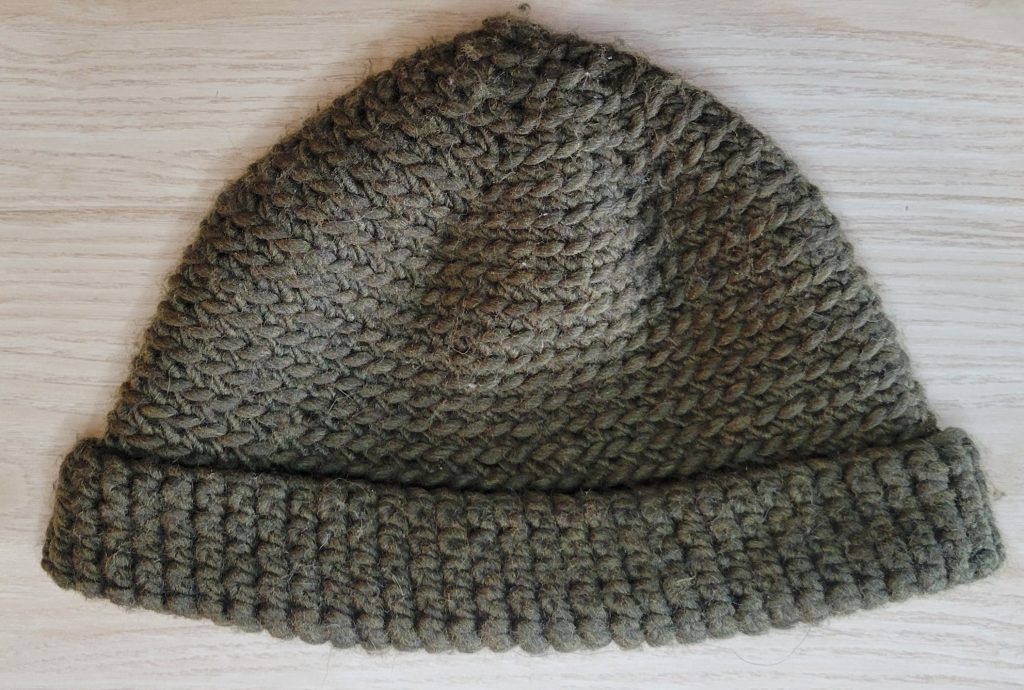 Crocheted green beanie hat.